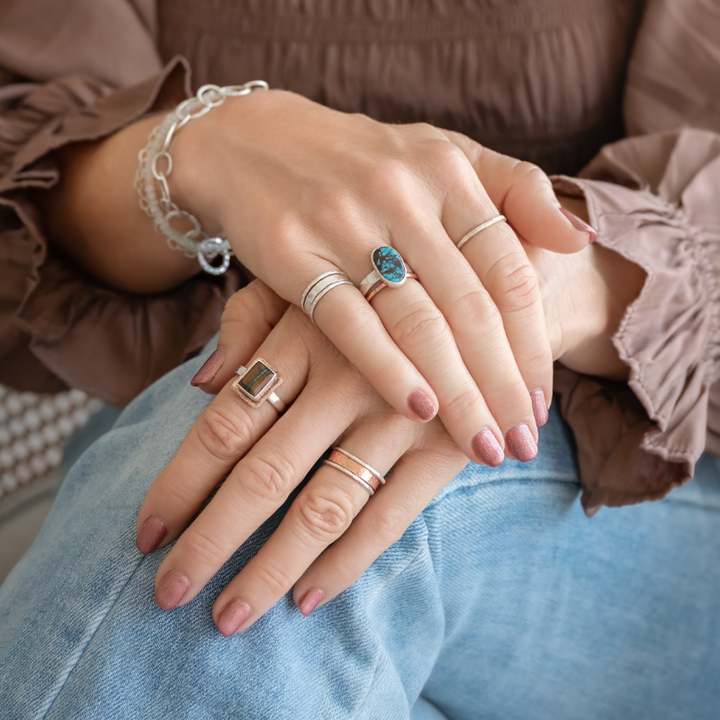 Oval Turquoise and Sterling Silver Ring with Hand-Hammered band. Shown styled with other rings, bracelets, and sold separately.