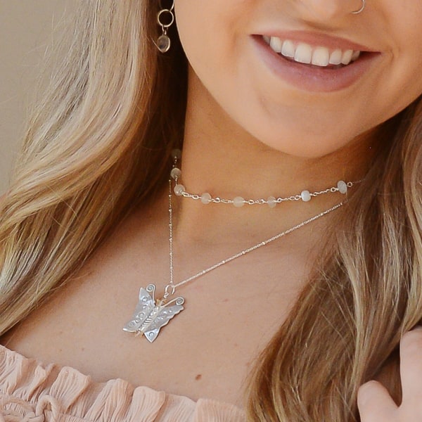 Get ready to radiate some serious beauty and style with the Butterfly Bliss Fine Silver Necklace. Whether you pair it with your favorite sundress or ruffled blouse, this necklace is sure to make you shine. Embrace your bold inner goddess and add a touch of elegance to any outfit with the Butterfly Bliss Necklace