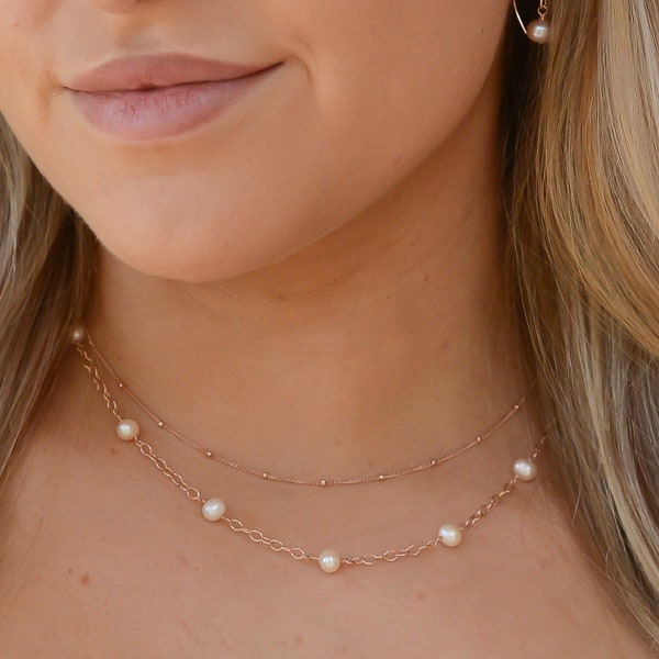 Luminous Roses Necklace modeled on Jessica- layered with a rose gold chain (not included)