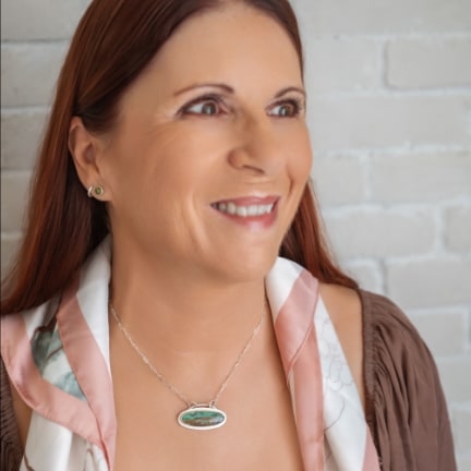 The unique 'surfboard' shaped cabochon inspired me to set it horizontally, creating a scene that captures the serene beauty of ocean depths—where stunning blue-green waters meet the shore.