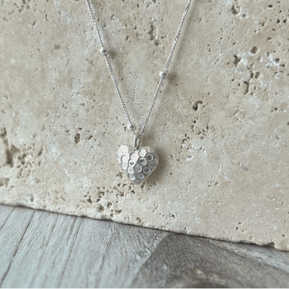 Fine silver heart necklace reveals the romantic & soft side of her personality. Looks lovely with all her sterling silver earrings. Simple and Beautiful Elegance.
