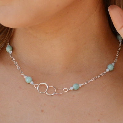 "Trinity" symbolizes the three interconnected circles, representing unity, balance, and completeness. "Reflection" aims to evoke feelings of elegance, sophistication, and self-reflection, highlighting its ethereal beauty.