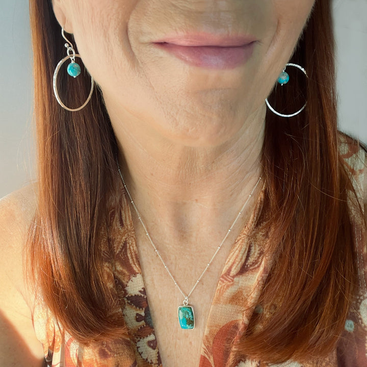 Turquoise Pendant Necklace worn with the Turquoise Large Silver Hoop Earrings.