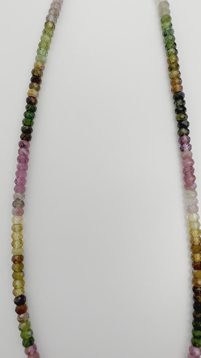 Tantalizing with Tourmaline Sparkle Choker. The gems are strung to match evenly from side to side for a beautifully balanced piece of wearable art. Handcrafted in California.