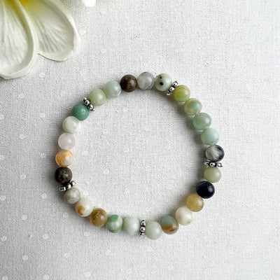 Need a little peaceful energy in your life? Try this Amazonite stretch bracelet with gems showing beautiful green and blue colors with the addition of black and gold hues. A comfortable stretch bracelet to add to your wrist stack.