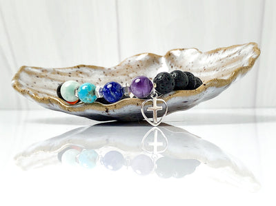 Semi-precious Gemstone 7 Chakra Bracelet, Sterling Silver Open Heart with Cross Charm, Lava Stone Bracelet, 8mm Beads, Handcrafted in CA.  This soul-inspired Chakra bracelet is handcrafted with 8mm lava & gemstone beads, Sterling Silver open heart cross charm, and antique silver-plated pewter spacers.