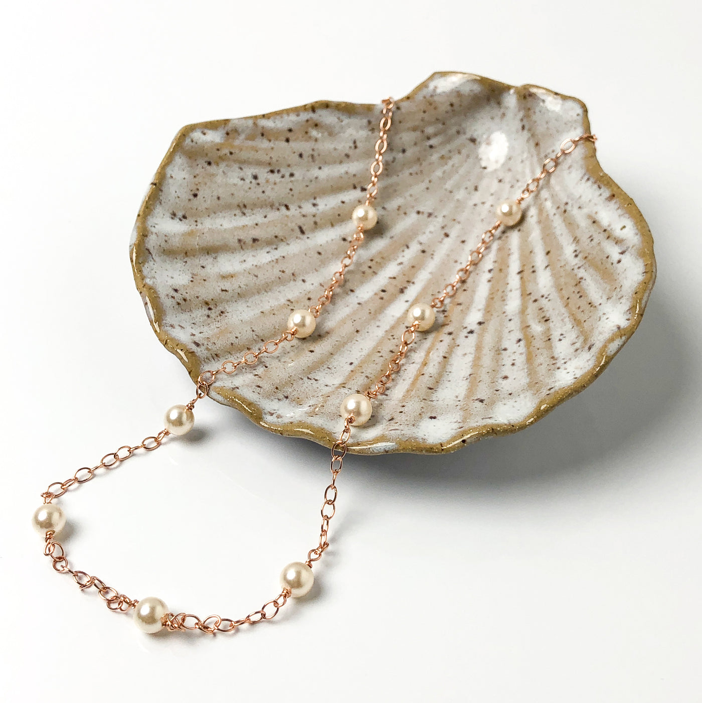 Inspired by the pearl and gold "gumball" necklace Madame VP- Kamala wears.  A faint golden-pink tone softens the white undertones of 6mm Swarovski crystal's light cream rose pearl, giving it a slightly vintage air. This subtle shade delivers a hint of shimmer and sophistication.