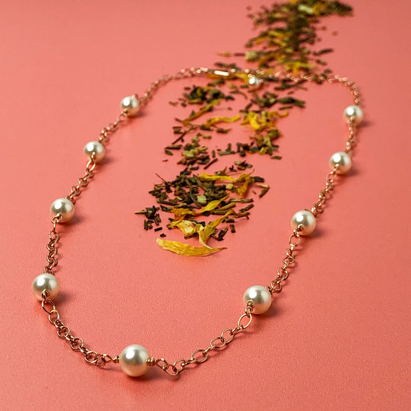 Inspired by the pearl and gold "gumball" necklace Madame VP- Kamala wears.  A faint golden-pink tone softens the white undertones of 6mm Swarovski crystal's light cream rose pearl, giving it a slightly vintage air. This subtle shade delivers a hint of shimmer and sophistication. Diagonal view