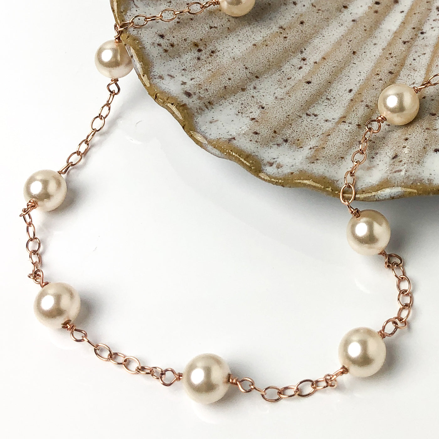Inspired by the pearl and gold "gumball" necklace Madame VP- Kamala wears.  A faint golden-pink tone softens the white undertones of Swarovski 8mm crystal's light cream rose pearl, giving it a slightly vintage air. This subtle shade delivers a hint of shimmer and sophistication. Detail view