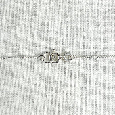 Show your love with this romantic and feminine heart necklace. Crafted from fine silver and strung along an 18” dainty chain, it is the perfect way to add a touch of delicate beauty to your everyday look. Clasp detail
