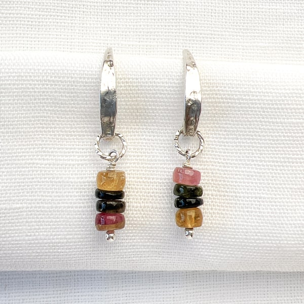 Discover the natural radiance and rainbow of colors of this tantalizing gemstone.   Stunning Tourmalines in raspberry pink, seafoam & forest green, and translucent amber colors. Elevate your casual Friday look with these lightweight earrings that shimmer in the sunlight.