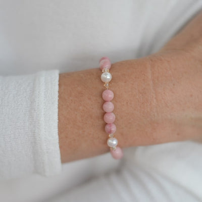 Discover your next piece to love and live in with this lovely Pink Opal and Pearl Bracelet. Shown on wrist.