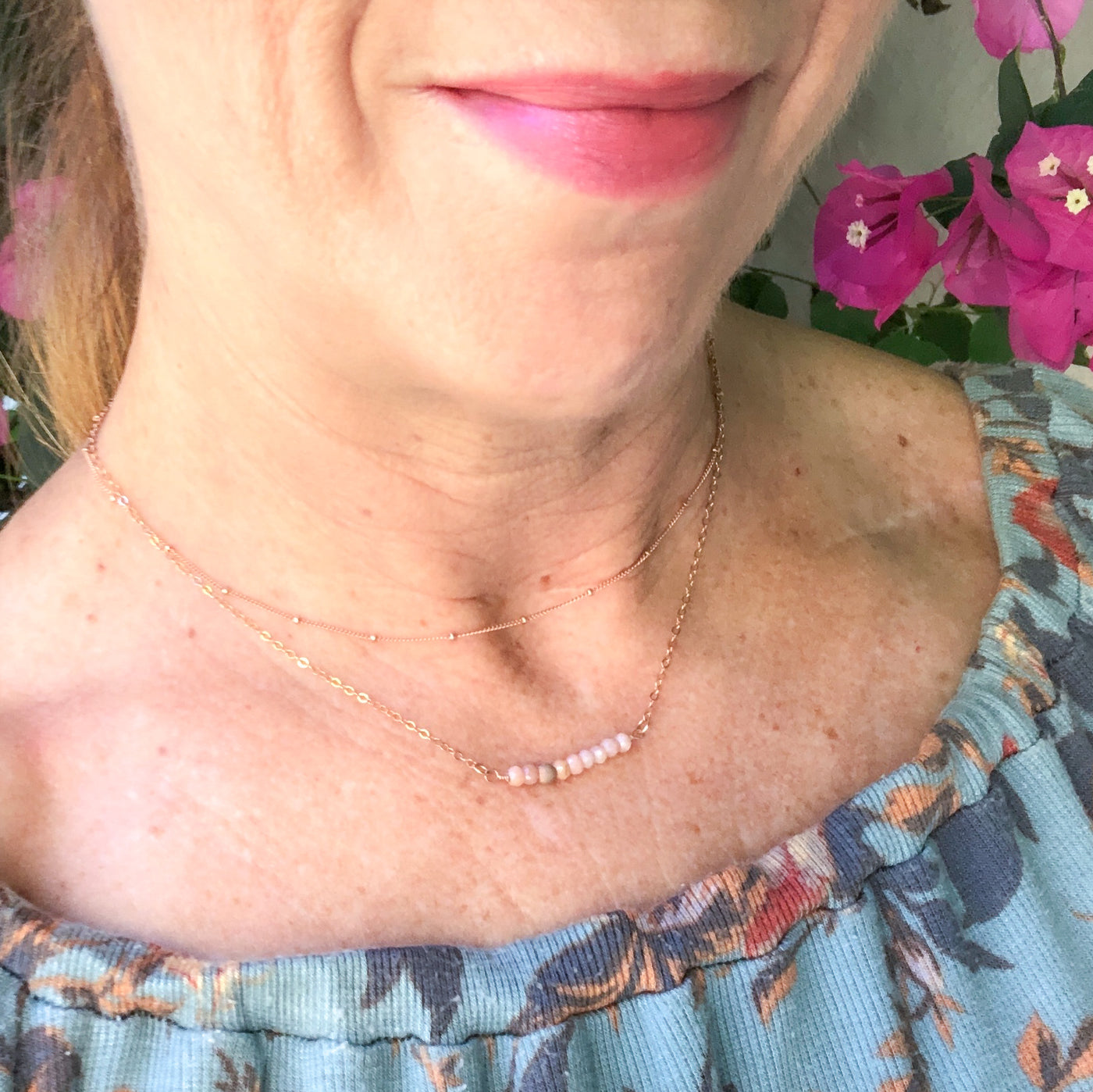 Delicate Pink Opal gemstone and Rose Gold-filled bar necklace. Perfect alone or for layering. The shine of the Rose Gold stardust bead compliments the opals nicely and gives the necklace an air of sophistication. Laura modeling.