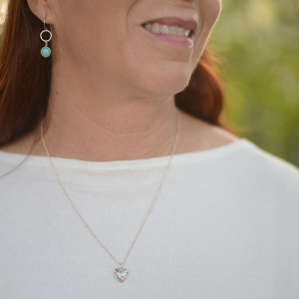 Fine silver heart necklace reveals the romantic & soft side of her personality. Looks lovely with all her sterling silver earrings. Simple and Beautiful Elegance. Worn with Turquoise earrings - not included.