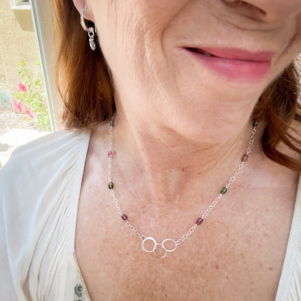 Tantalize with Tourmaline Collection. Novaura Jewelry of California. Tourmaline Sterling Silver Circles necklace and Clear Green Earrings.