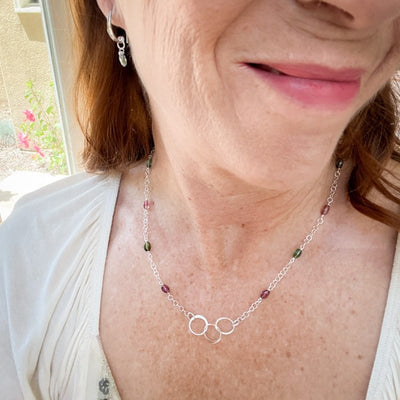 Tantalize with Tourmaline Collection. Novaura Jewelry of California. Tourmaline Sterling Silver Circles necklace and Clear Green Earrings.