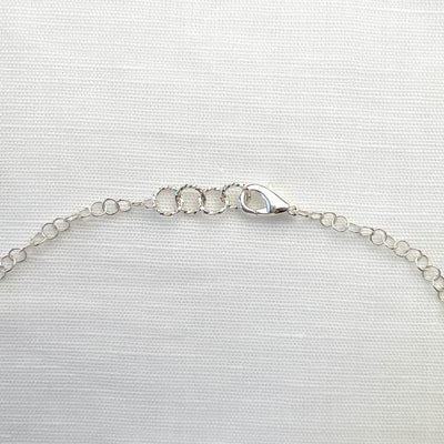 Tantalizing with Tourmaline and Sterling Silver Triple Circle Necklace. Clasp detail. Handcrafted in California.