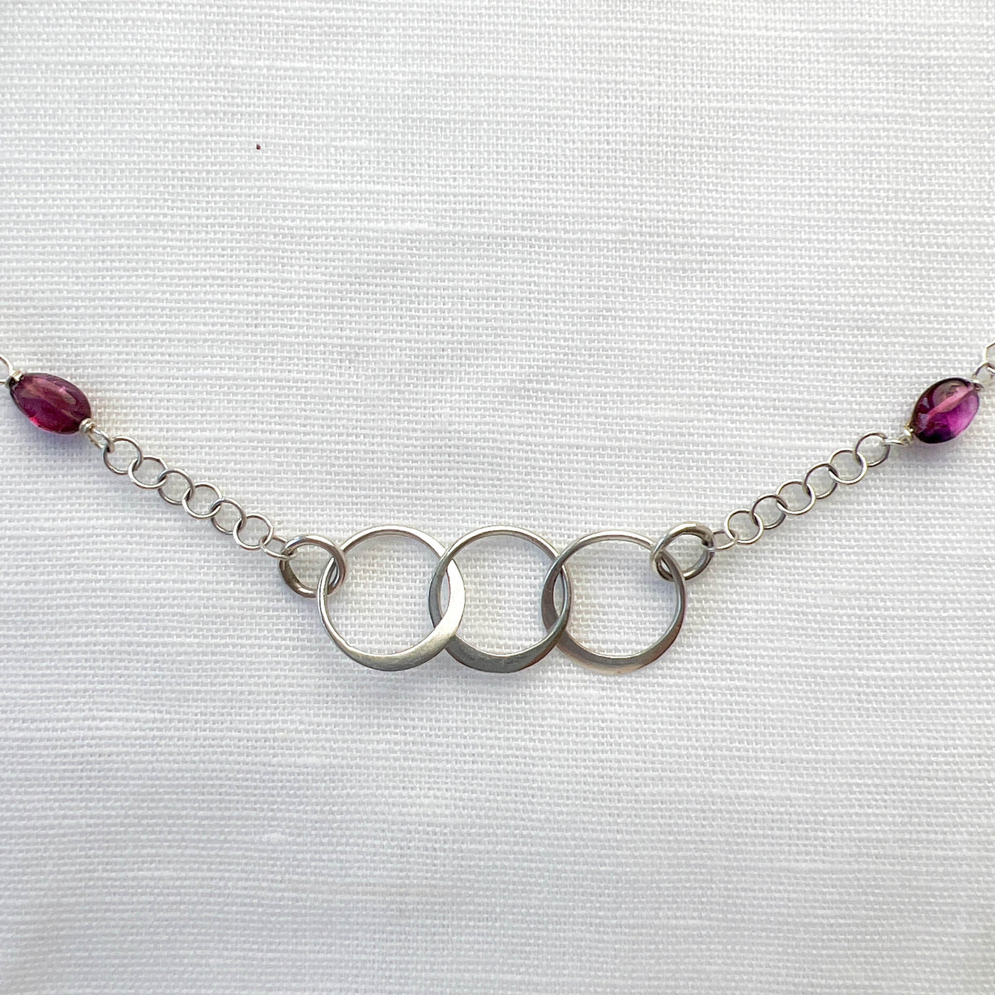 Tantalizing with Tourmaline and Sterling Silver Triple Circle Necklace. Front detail. Handcrafted in California.