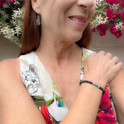 Delicate Heishi Yungai & Silver-plated 14mm hammered silver circles. Lightweight and graceful. Paired with the small sea-green heishi beads and black lava rock bracelet.  Shown on model. Handcrafted in California. 